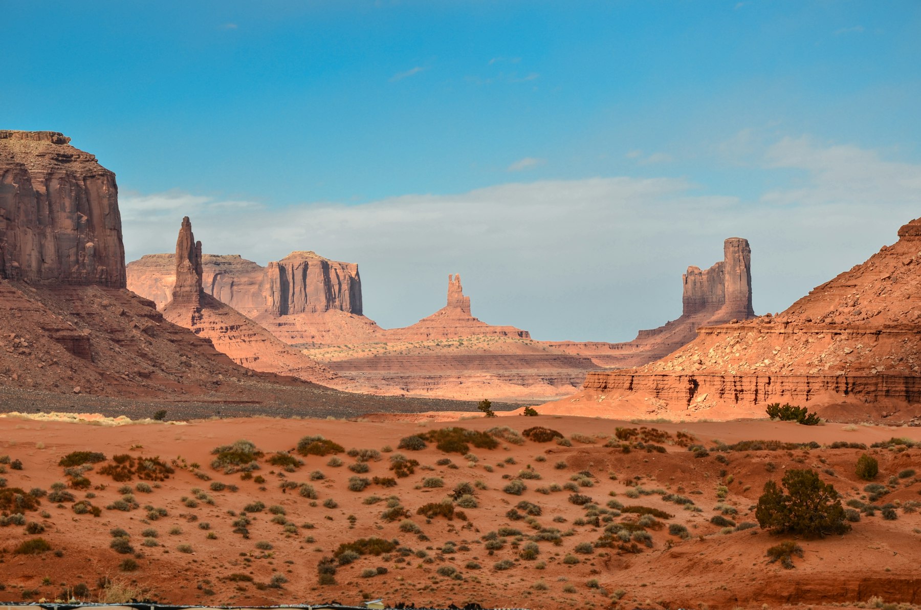 Layered desert rock formations under a clear sky